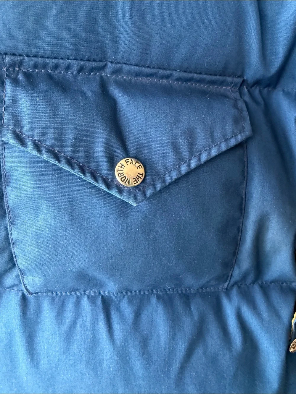 The North Face vintage blue goose down fill snap up puffer vest Men’s sz L